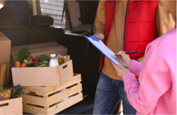 person picking up groceries curbside