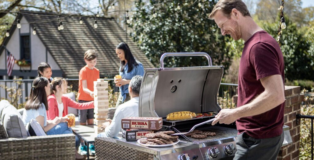 A backyard family barbecue with BUBBA burgers