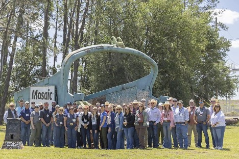 A group on tour outside the Mosaic Four Corners Mine