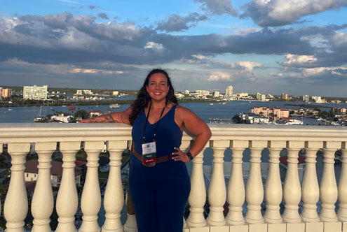 Erica Prescott posing in front of the Tampa coastline