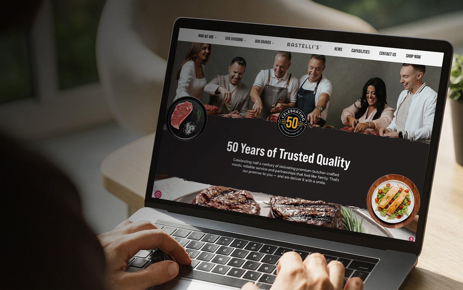 A viewer sitting at a desk using the Rastelli's Foods website
