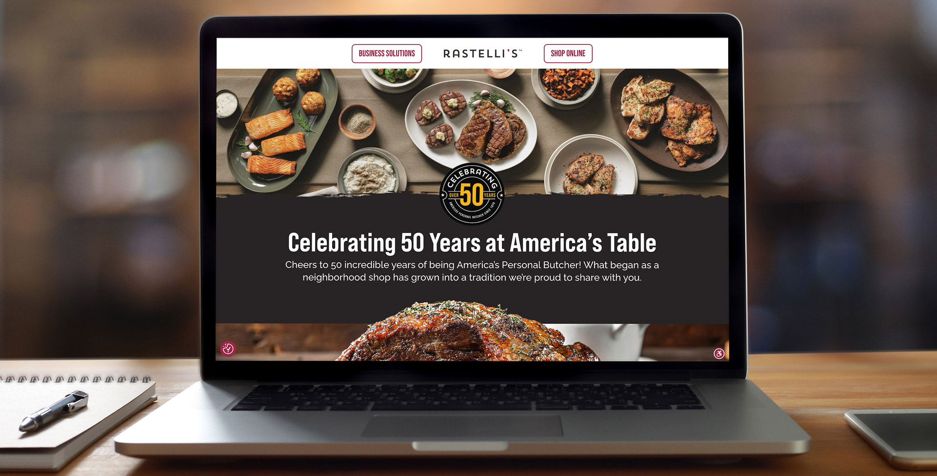 A monitor displaying the Rastelli Foods website