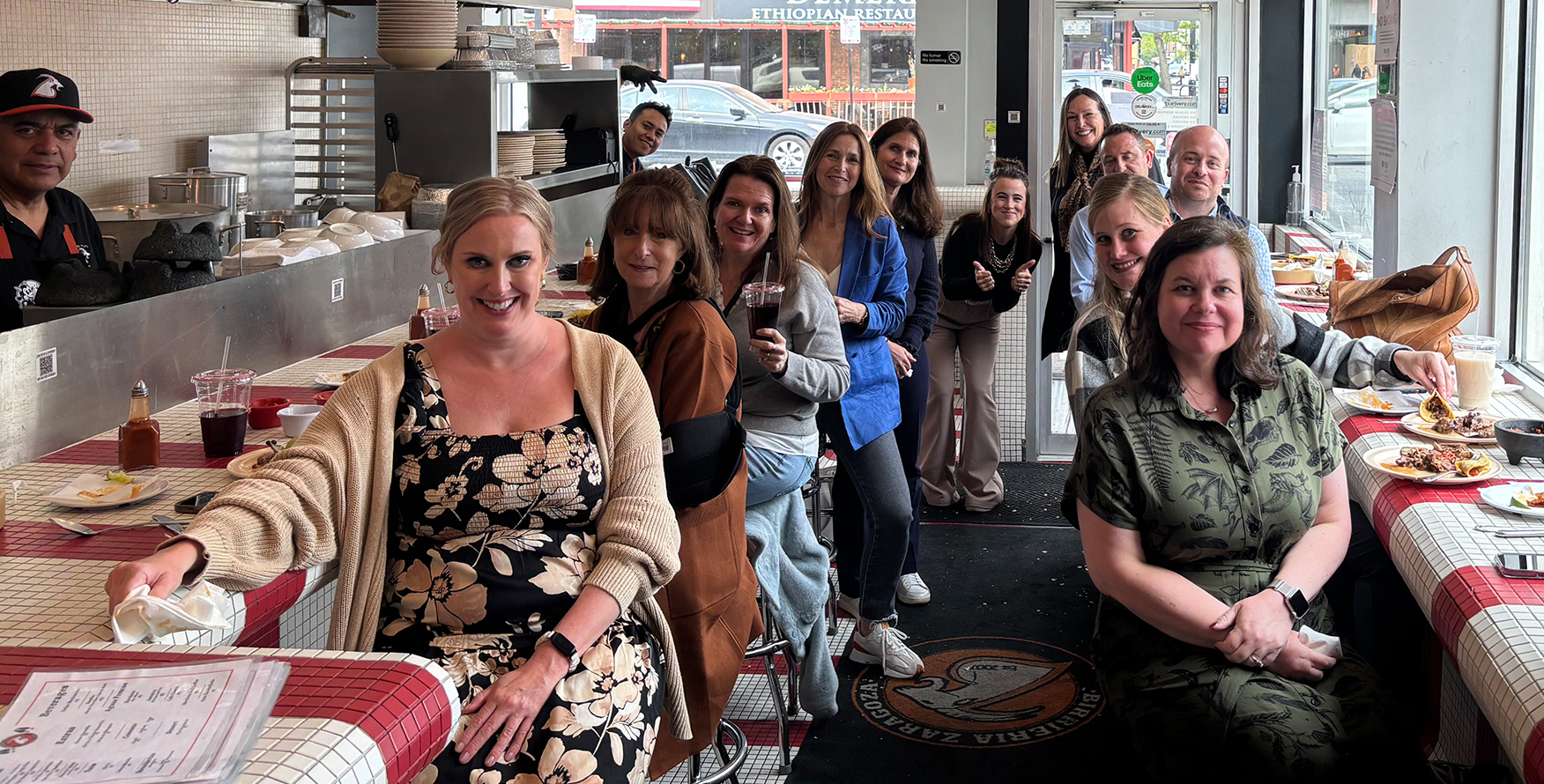 a group of people eating at a diner